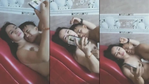 Bị hai chị gái vắt cho kiệt sức em trai chỉ biết nằm im để các chị quay phim